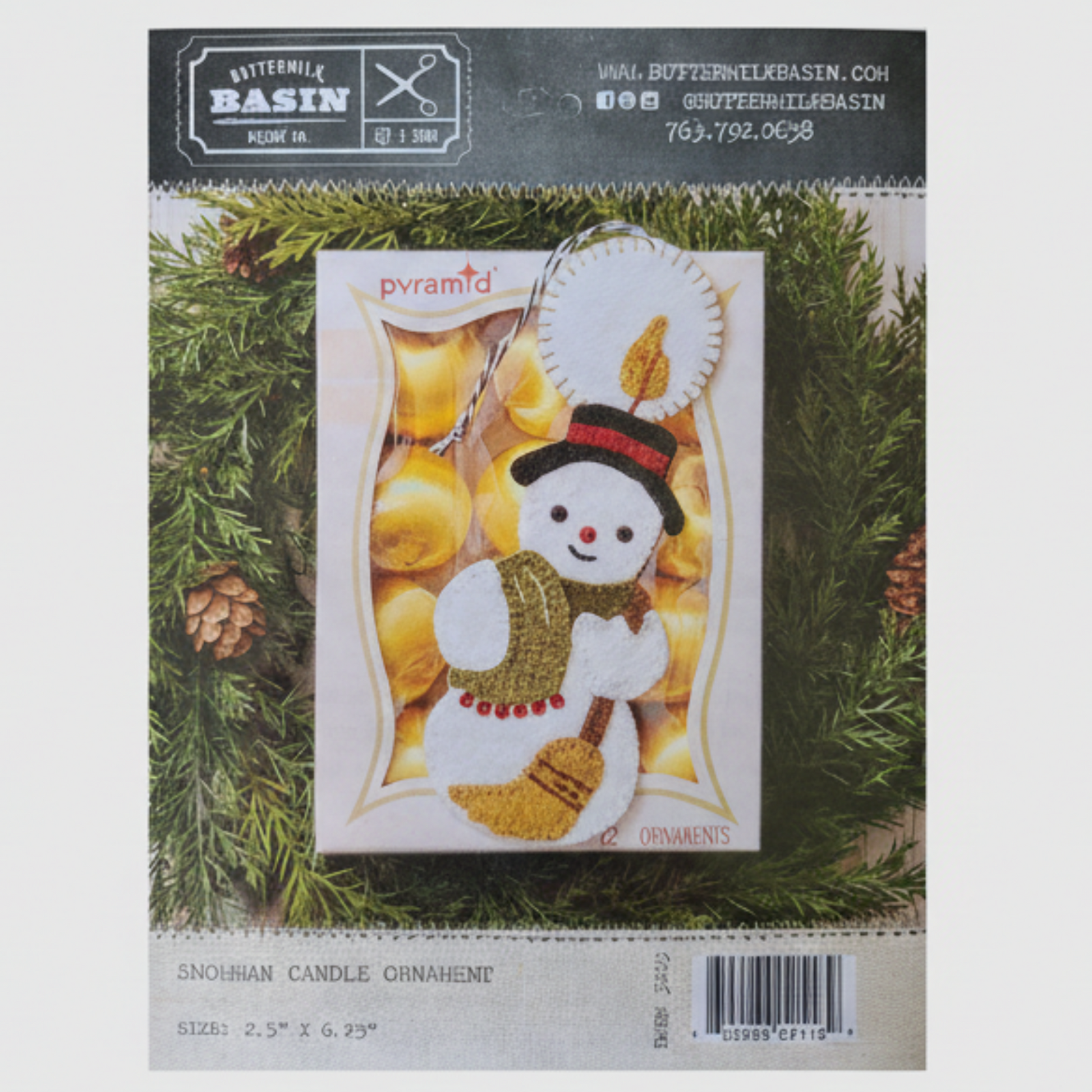 Snowman candle ornament packaging on a green leaf background