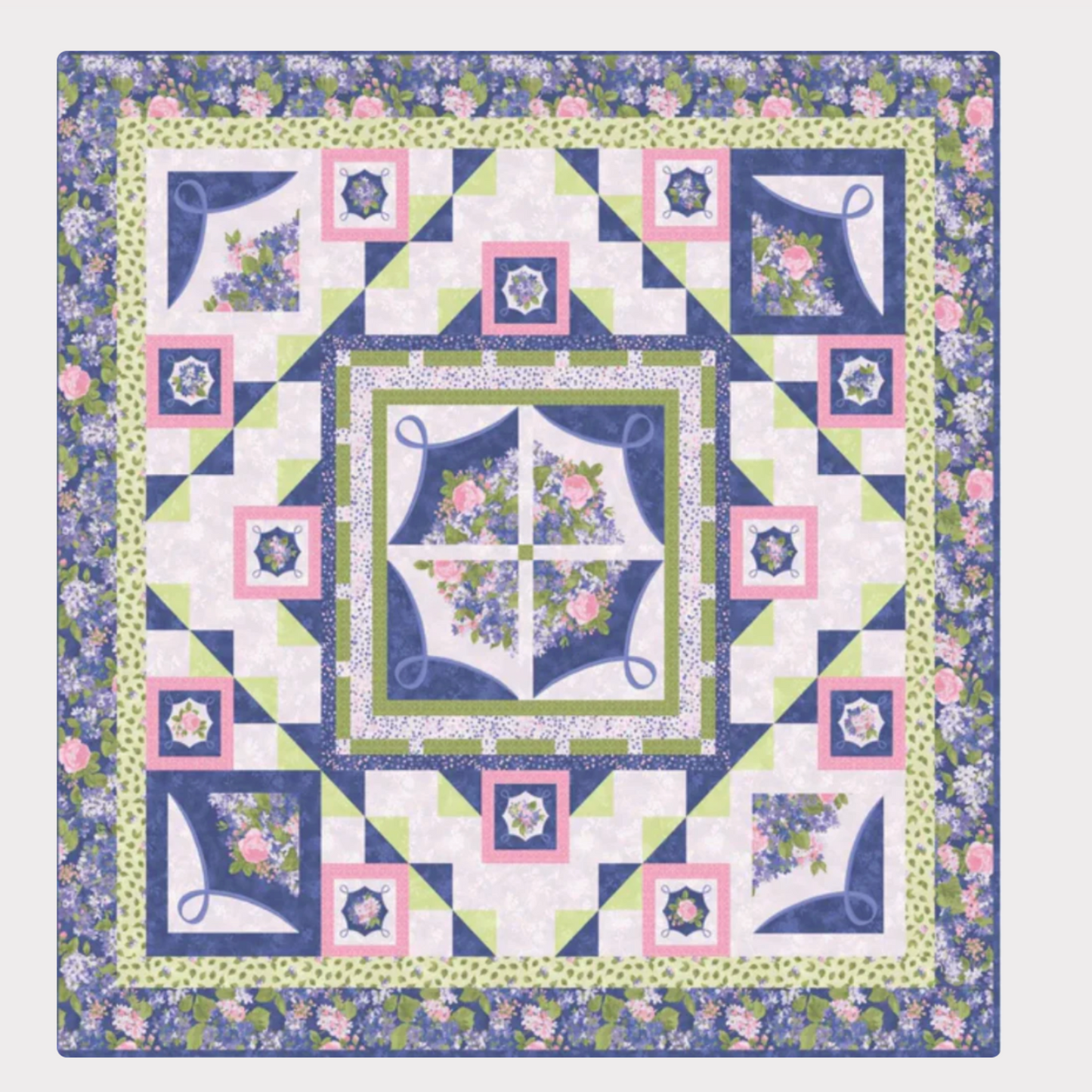 Quilt with floral patterns and geometric designs on a white background