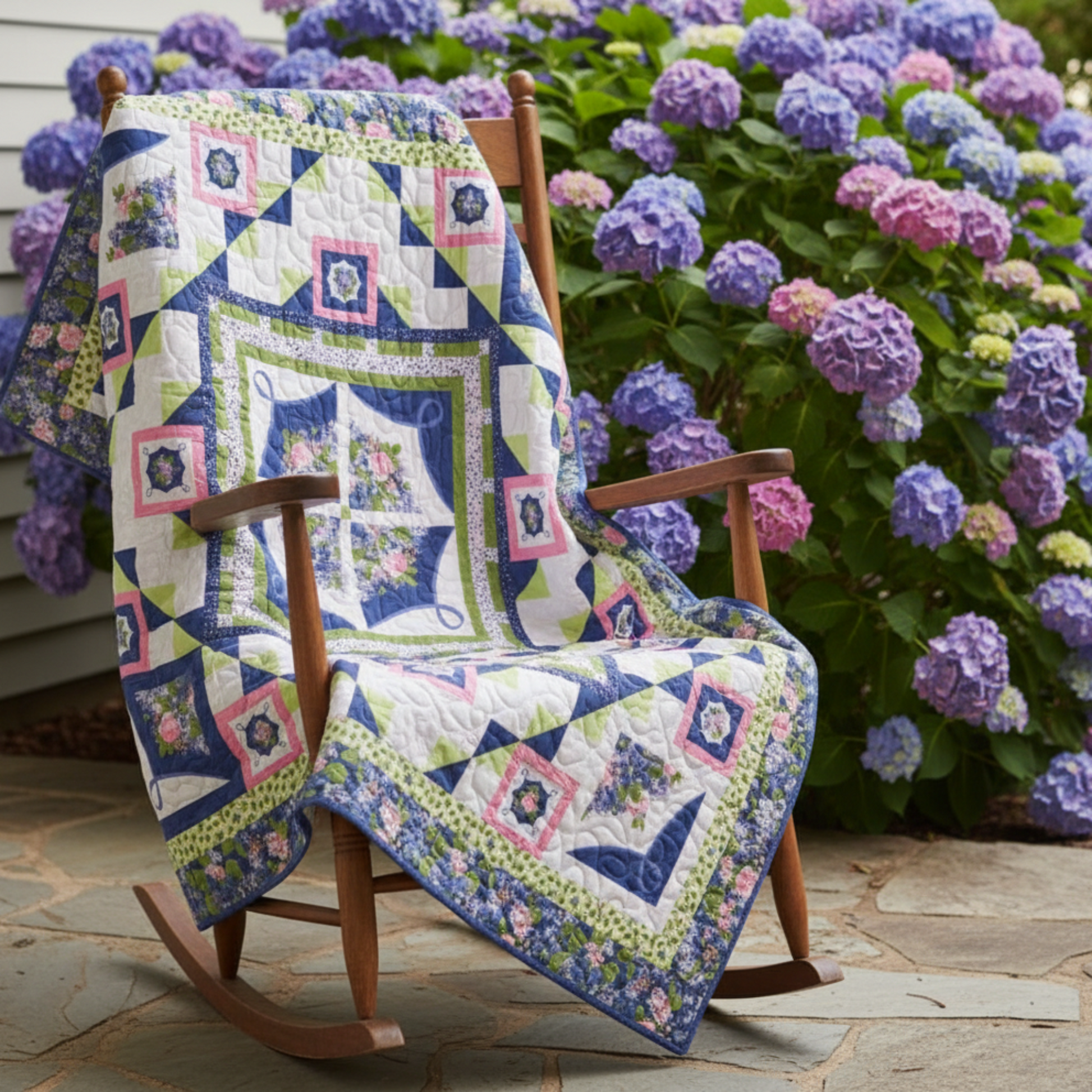 Quilt with floral patterns and geometric designs on a white background