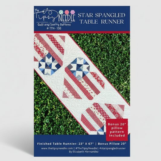 Star Spangled Table Runner pattern by The Tipsy Needle on a grass background