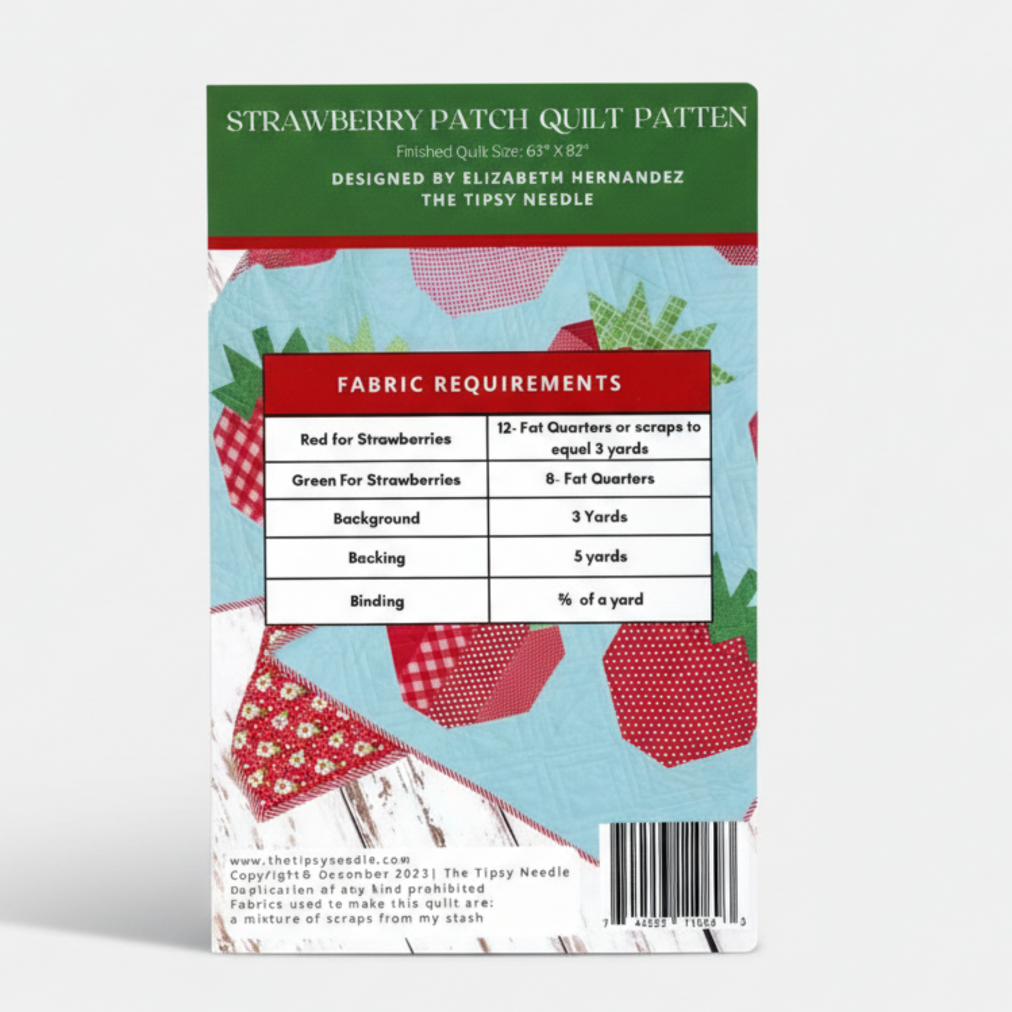 Strawberry Patch quilt pattern book with fabric requirements on a white background