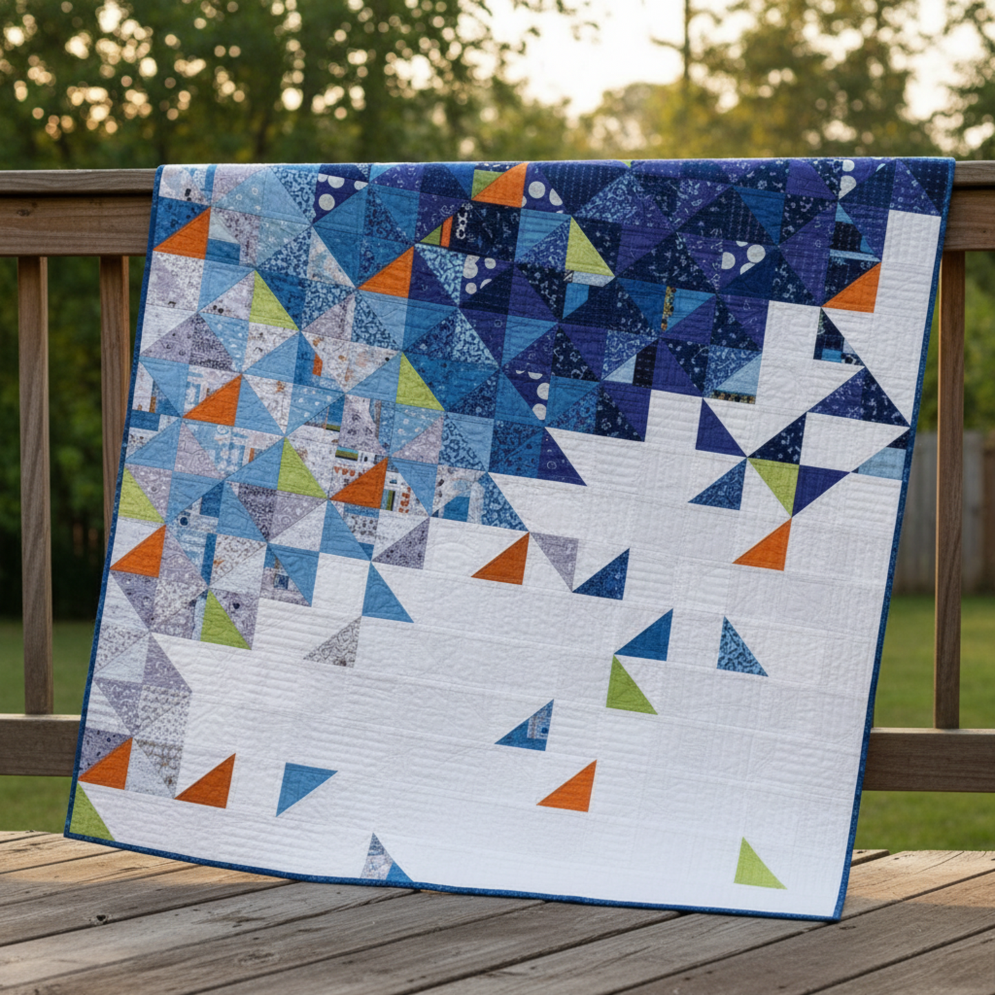 Living room with a geometric patterned quilt on the wall, featuring the brand 'Zen Chic'.