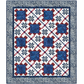 Quilt with a geometric pattern featuring blue, red, and white squares on a white background.