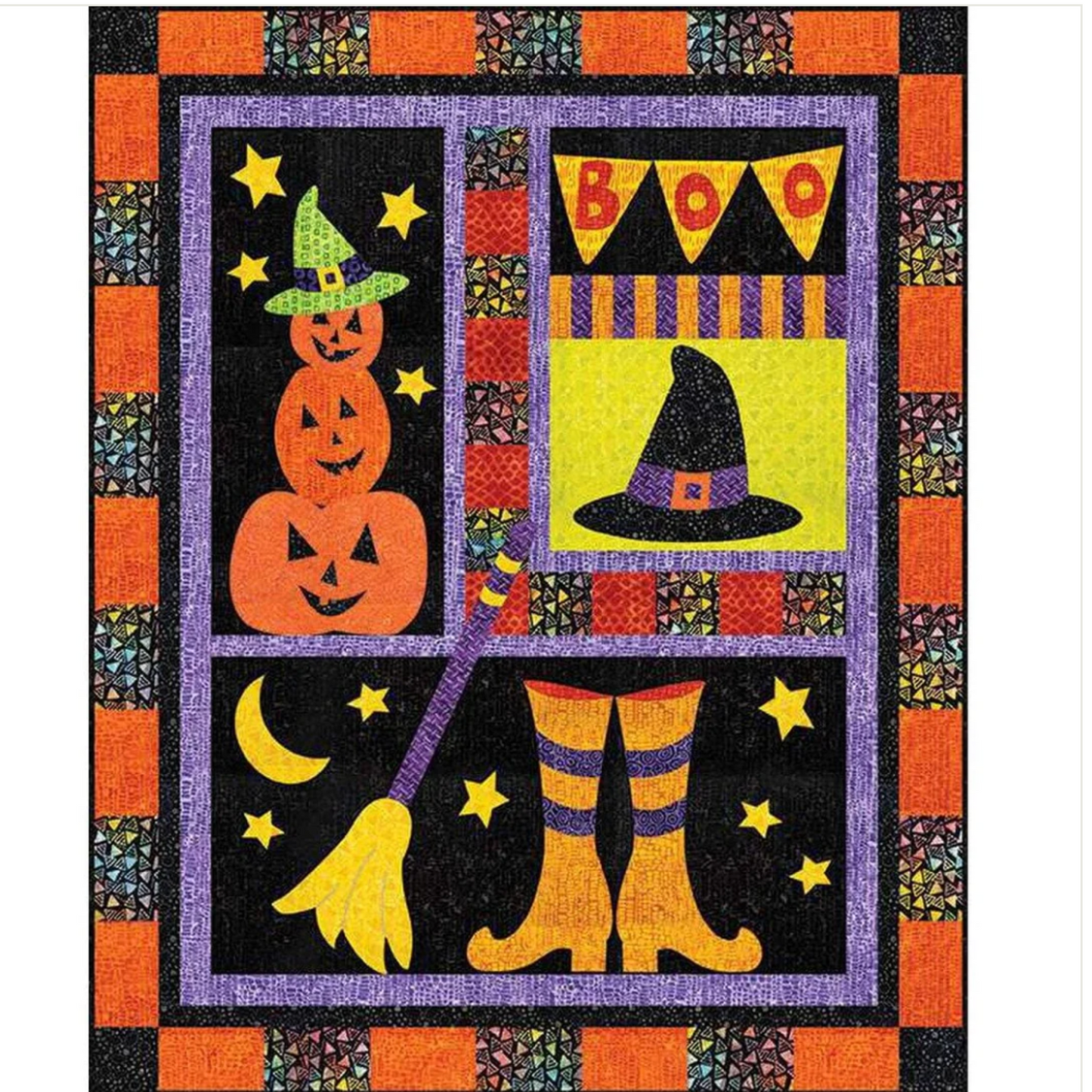 Halloween-themed quilt with pumpkins, witch hat, boots, and 'BOO' banner.