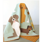 Quilt with dog illustrations on a light background