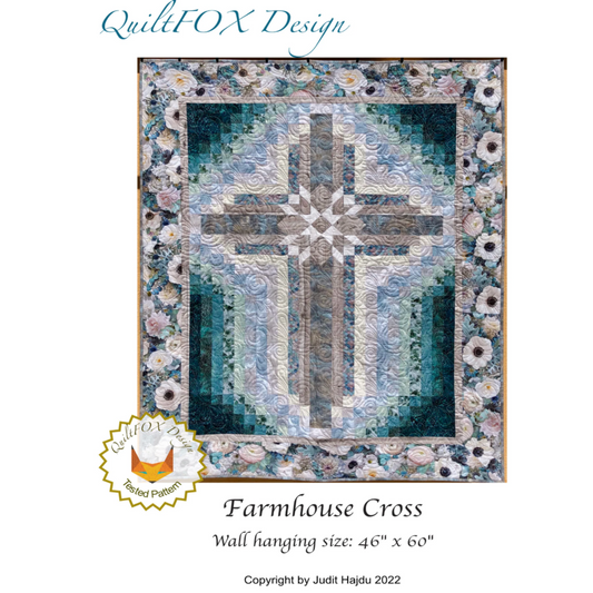 Quilt with cross design and floral elements, branded 'QuiltFOX Design'.