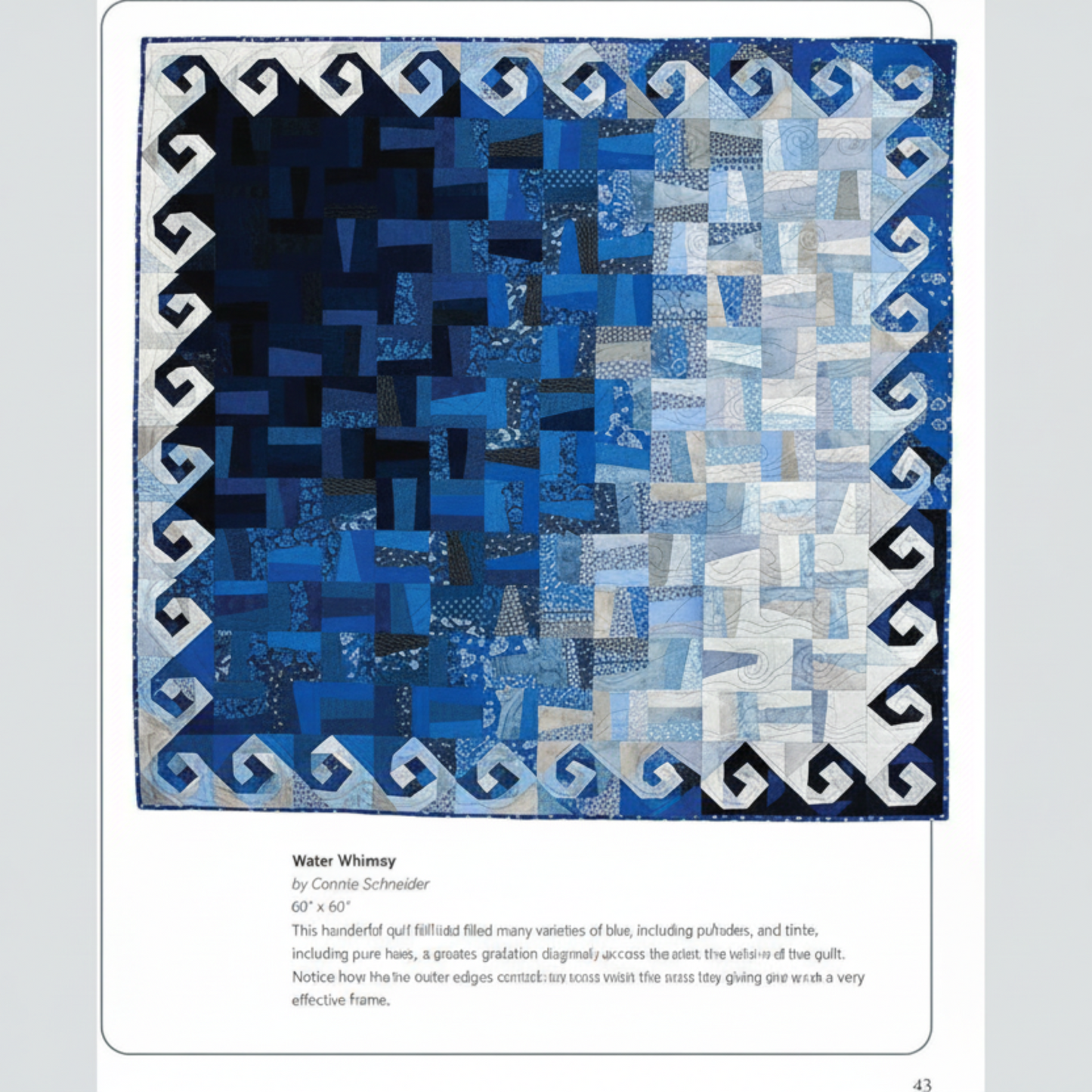 Blue and white quilt with geometric pattern on a white background