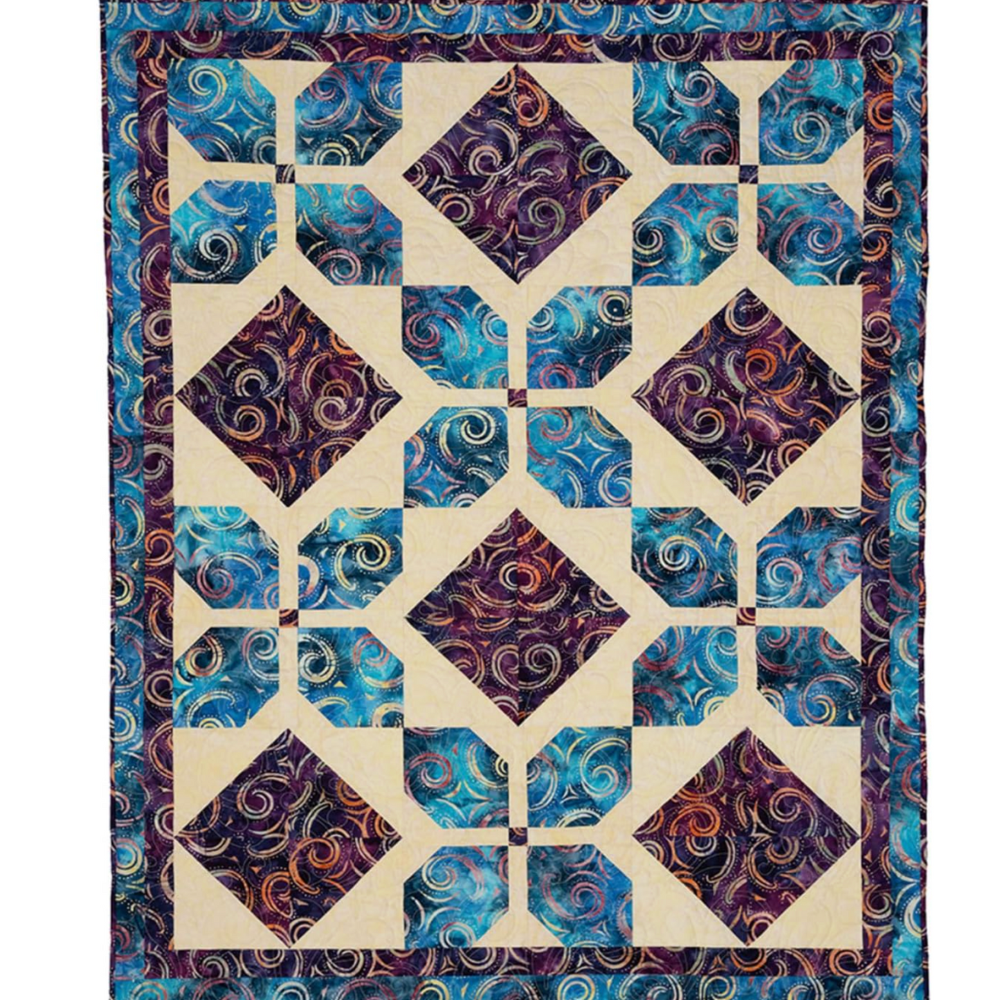 Finished lap quilt made from Double Focus 3-Yard Quilts pattern using coordinated fabrics