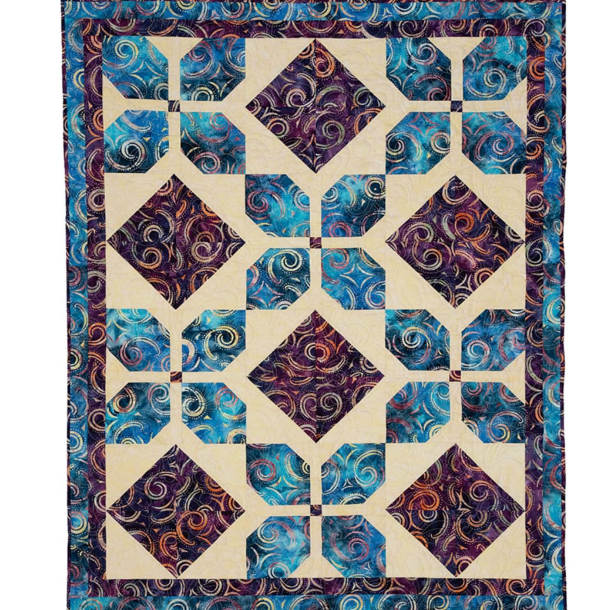 Finished lap quilt made from Double Focus 3-Yard Quilts pattern using coordinated fabrics