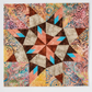 “Paper-pieced star quilt block using multicolor batik fabrics from Carol Doak quilting book”