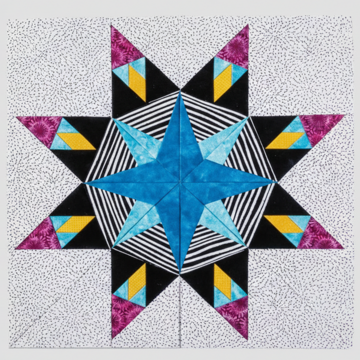 “Modern paper-pieced star quilt block with striped center from 60 Fabulous Paper-Pieced Stars”