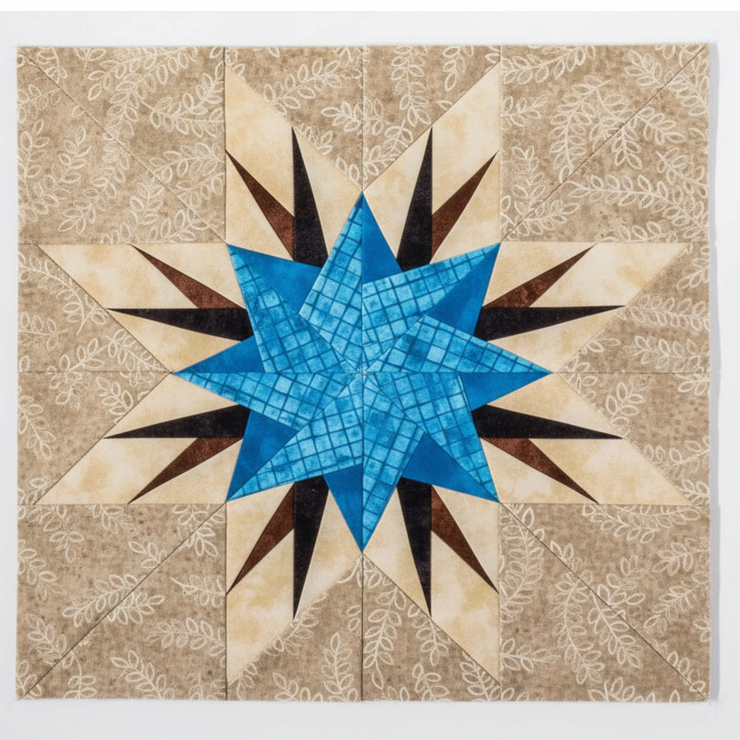 “Paper-pieced blue star quilt block on neutral background from Carol Doak quilting book”