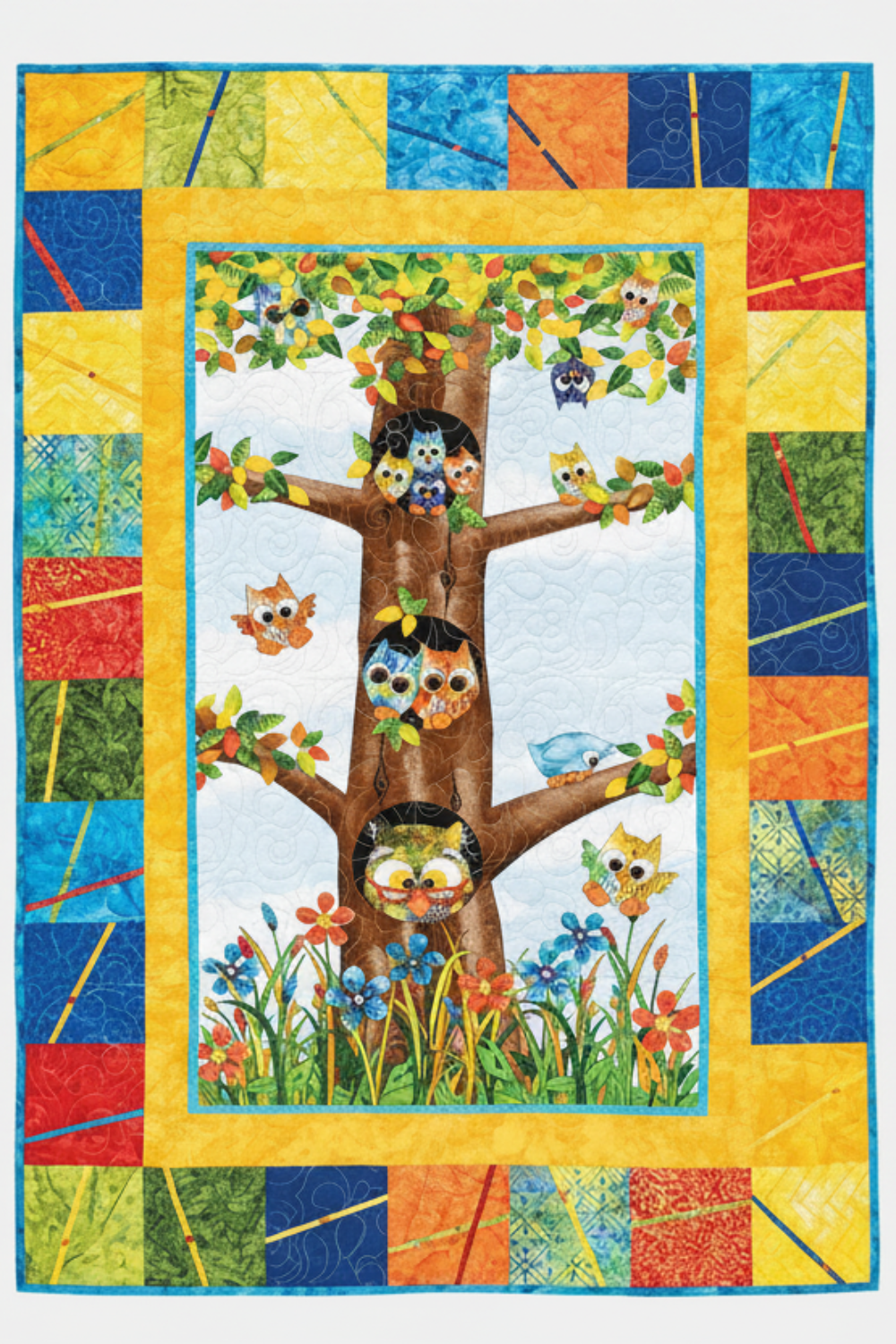 Panel quilt featuring whimsical owl fabric panel with bright patchwork borders
