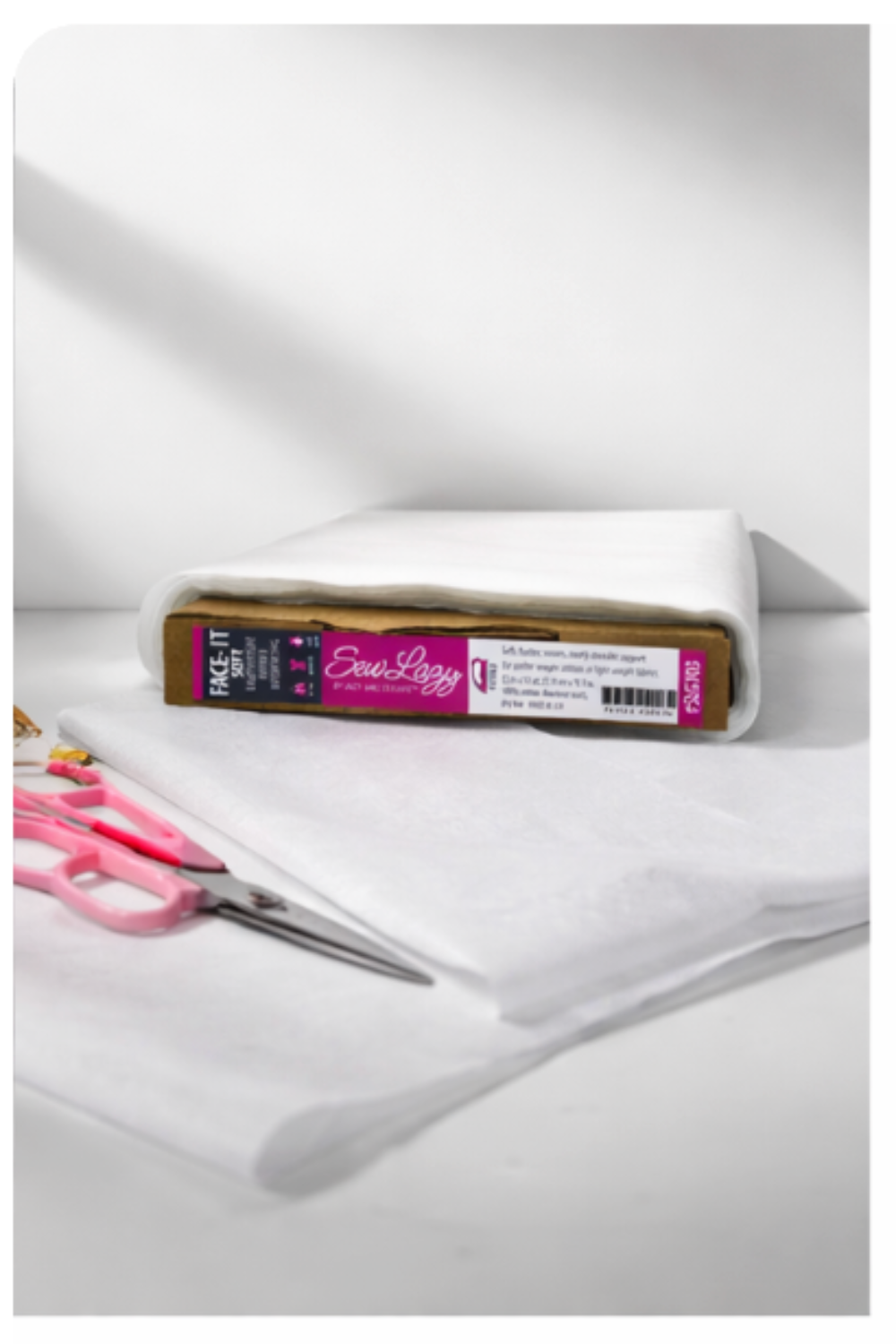 Sew Lazy Face-It Soft fusible interfacing sheets with sewing scissors on work surface
