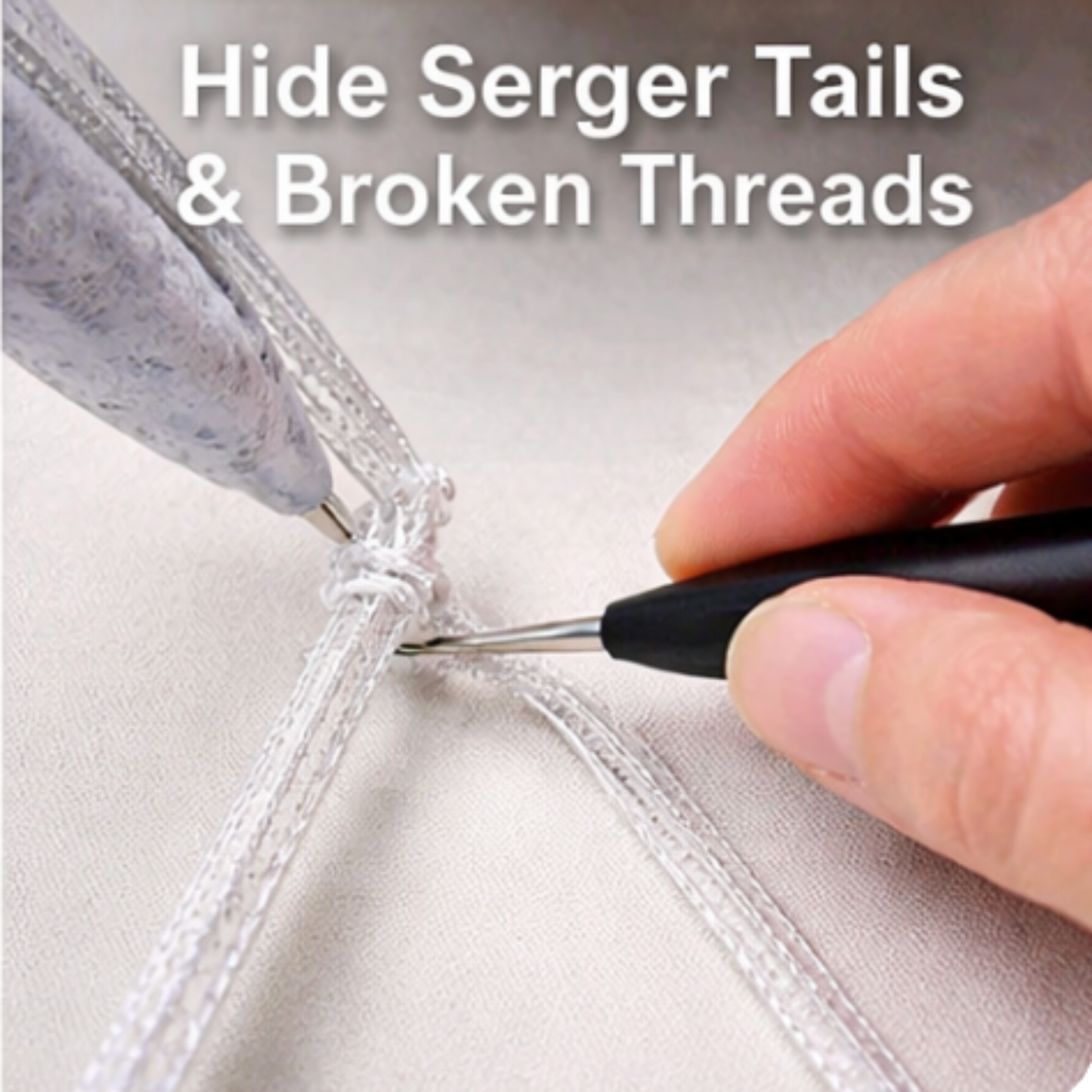 Hand using a tool to hide serger tails and broken threads on fabric.