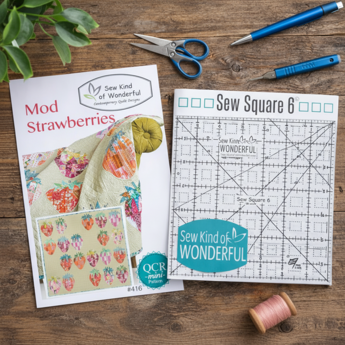 Sew Square 6 ruler with Mod Strawberries quilt pattern on wooden table