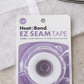 Quilting essentials flat lay with HeatnBond EZ-Steam batting tape and iron for clean, professional quilt finishes