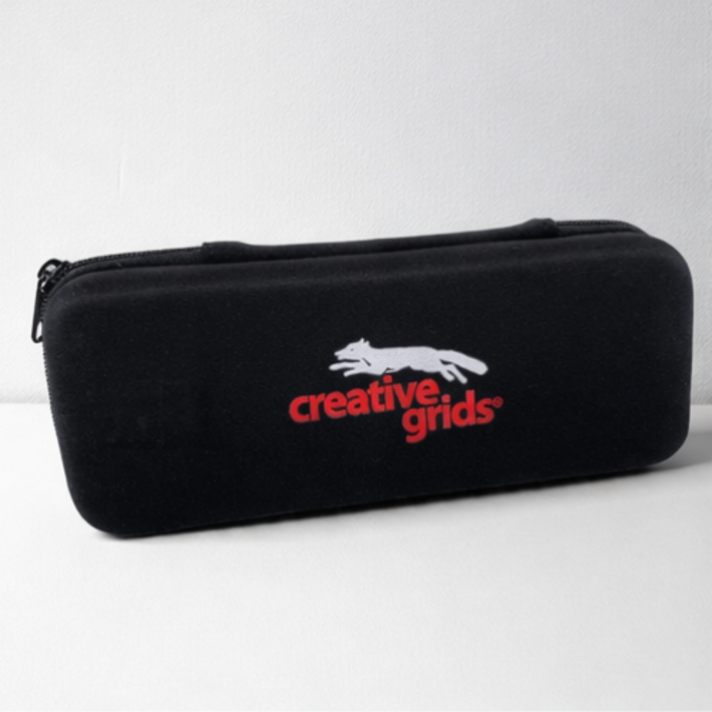 Black case with 'creative grids' logo on a white background