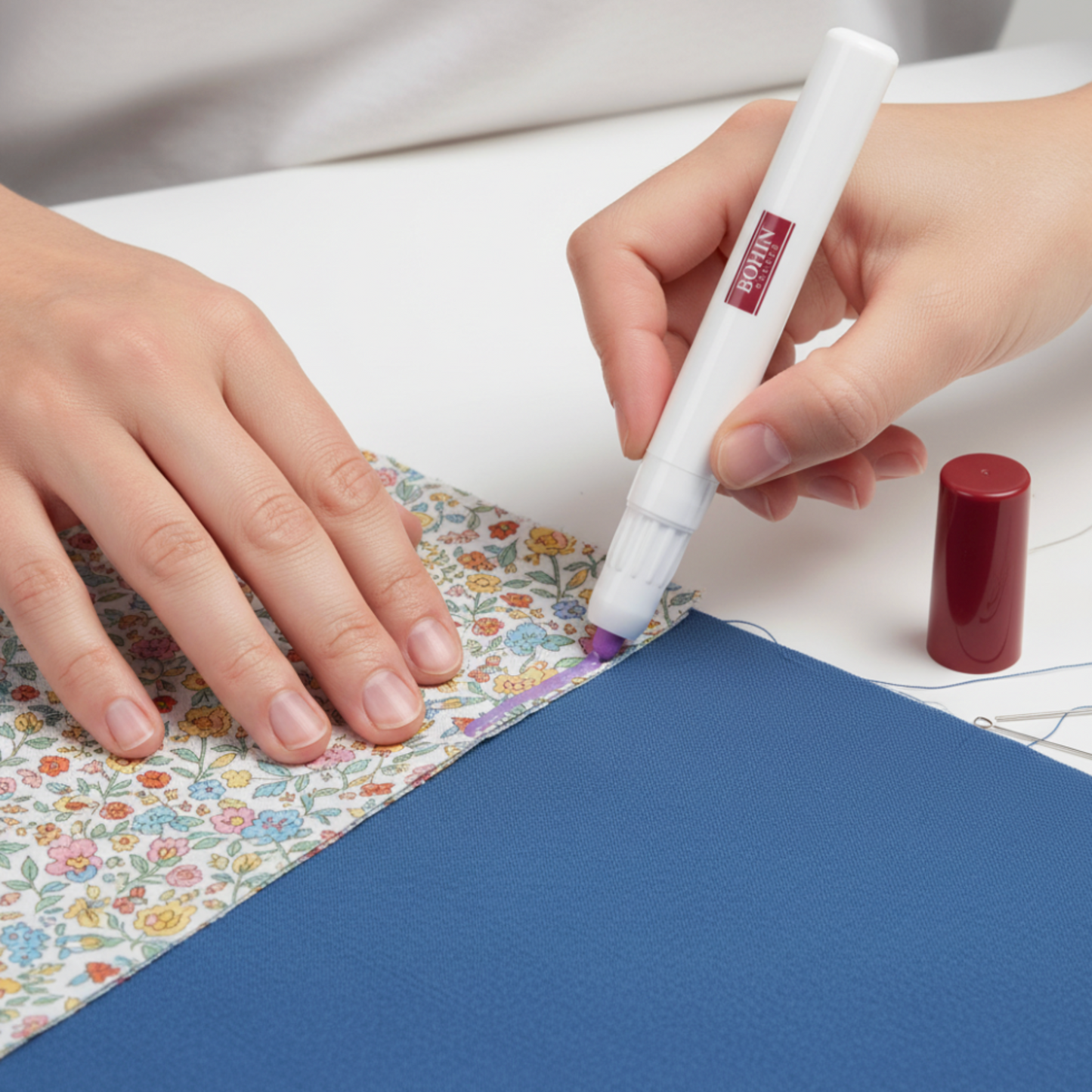 Using Bohin temporary fabric glue pen to hold quilt fabric pieces in place before sewing