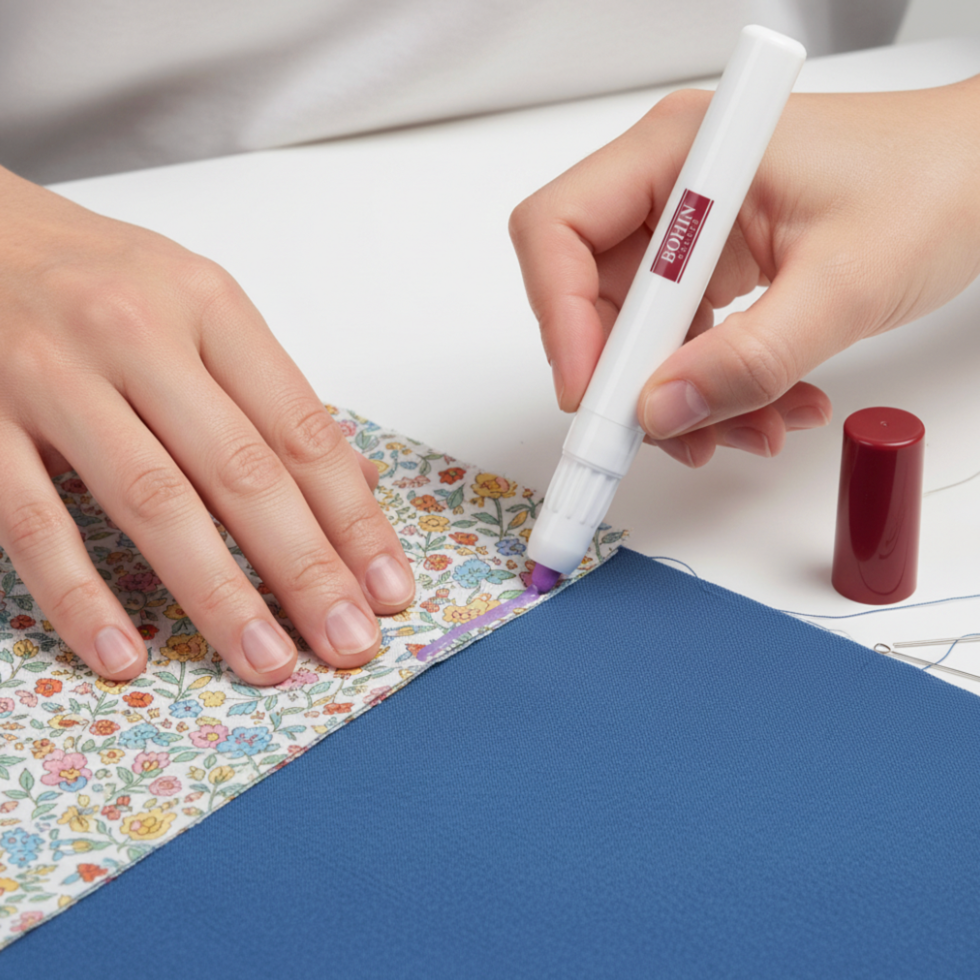 Using Bohin temporary fabric glue pen to hold quilt fabric pieces in place before sewing