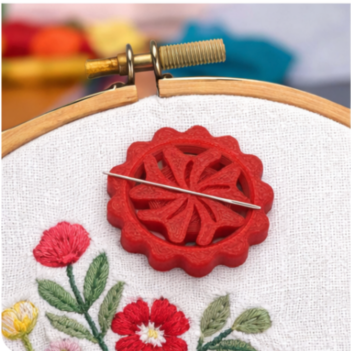 Ruby needle minder attached to embroidery hoop fabric, magnetic holder for quilting and cross-stitch projects