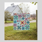 Barn star sampler quilt – colorful star quilt hanging outdoors on barn clothesline