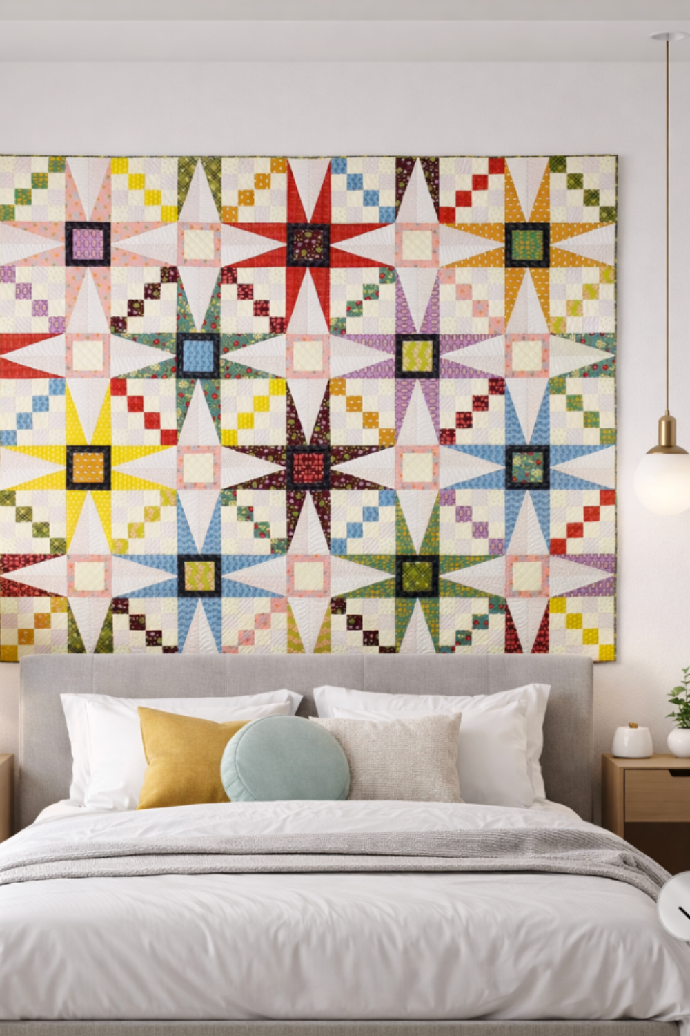 Quilt in bedroom – Solarium star quilt hanging above bed – modern quilted wall decor with star blocks