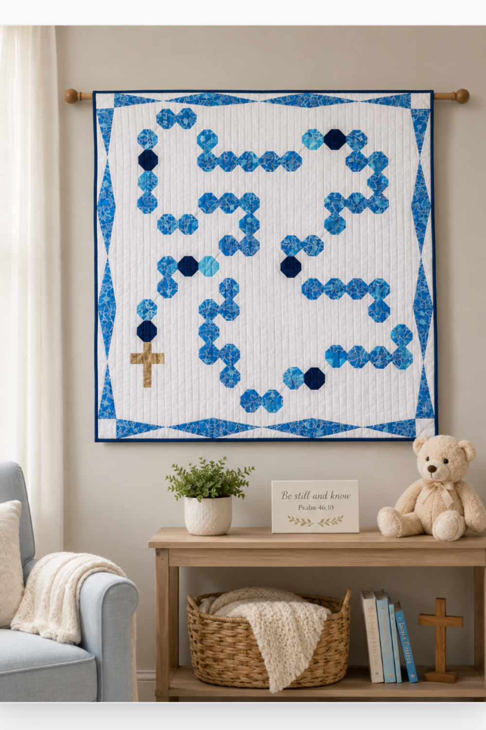 Rosary Baby Quilt wall hanging displayed in peaceful nursery with soft neutral décor, teddy bear, and inspirational Christian accents