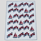 Handmade Sailing School sailboat quilt with red and navy sailboats, patchwork blocks, and white quilted background.
