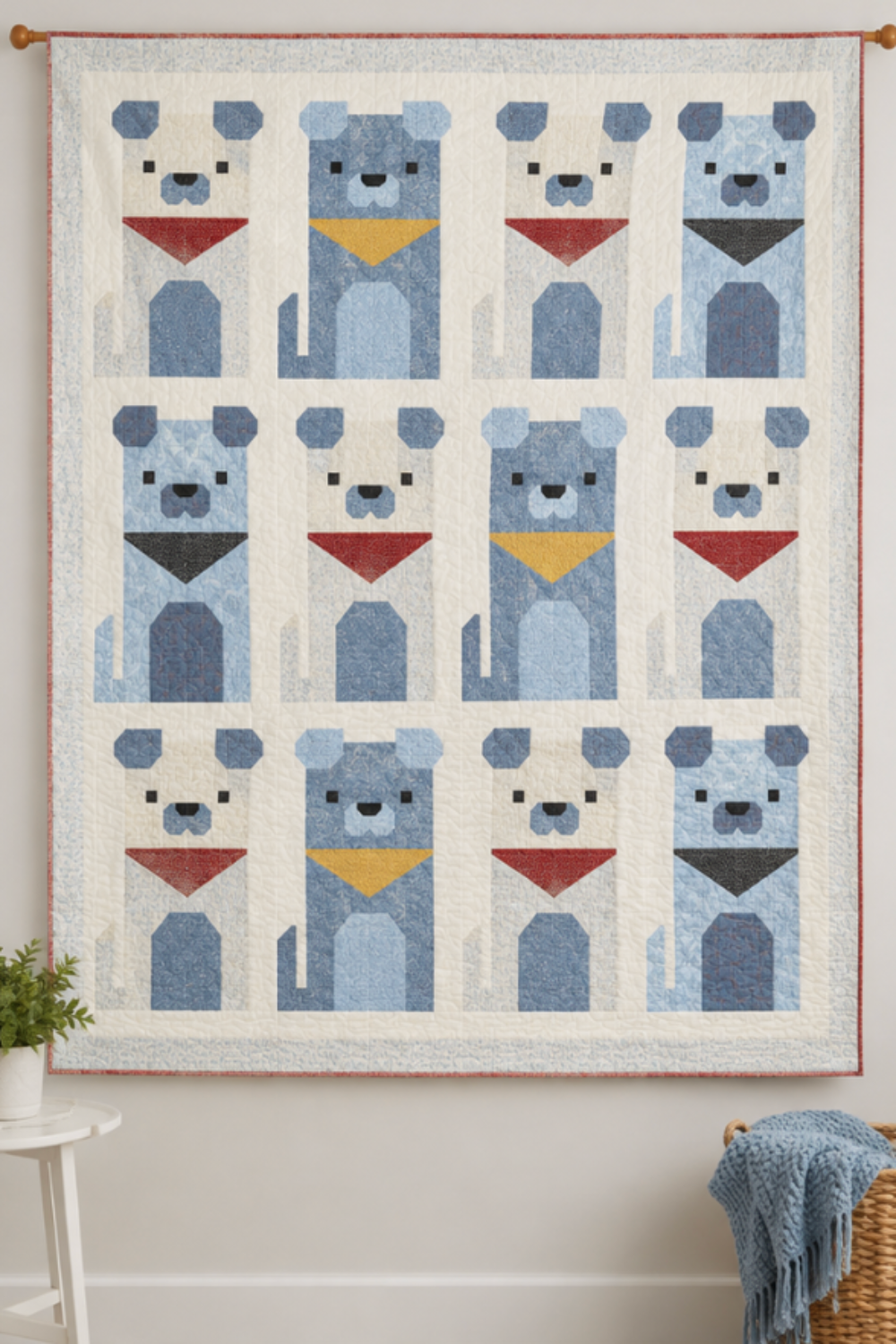 Handmade puppy quilt with twelve blue geometric dog blocks and colorful bandanas displayed as a wall hanging, featuring detailed quilting and a soft blue border.