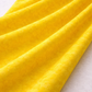Expressions Batiks Hand-Dyed Bumblebee quilting cotton fabric by Riley Blake Designs – bright bumblebee yellow hand-dyed batik in soft folds on flat surface showing texture and tonal variation