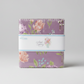 Adel in Spring Charm Pack by Sandy Gervais for Riley Blake Designs – side view of factory-sealed 42-piece 5" x 5" lavender floral cotton charm squares