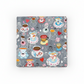 Alice Multi Teacups quilting cotton fabric folded to show whimsical allover scatter print with teacups, saucers, spoons, red hearts, and pink flowers on soft grey – Mad Hatter tea party design by Jason Yenter for In The Beginning Fabrics, 100% cotton, 3 yard cut
