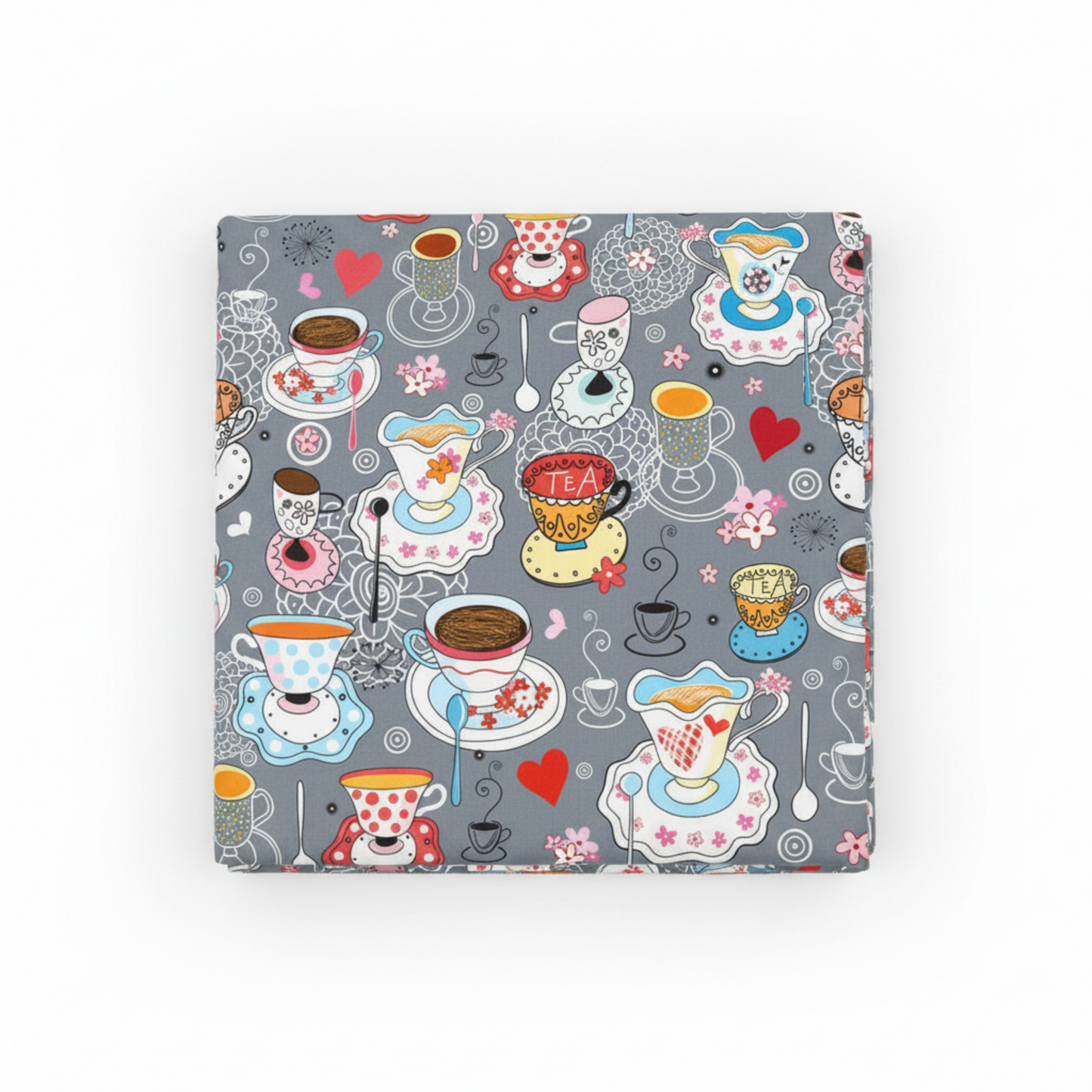 Alice Multi Teacups quilting cotton fabric folded to show whimsical allover scatter print with teacups, saucers, spoons, red hearts, and pink flowers on soft grey – Mad Hatter tea party design by Jason Yenter for In The Beginning Fabrics, 100% cotton, 3 yard cut