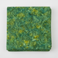 Expressions Batiks Hand-Dyes Amazon quilting cotton fabric by Riley Blake Designs folded into a neat square showing rich jungle green hand-dyed batik with warm golden-yellow undertones and organic swirling mottled texture – a vibrant tonal blender, 100% cotton batik, 43–44" wide