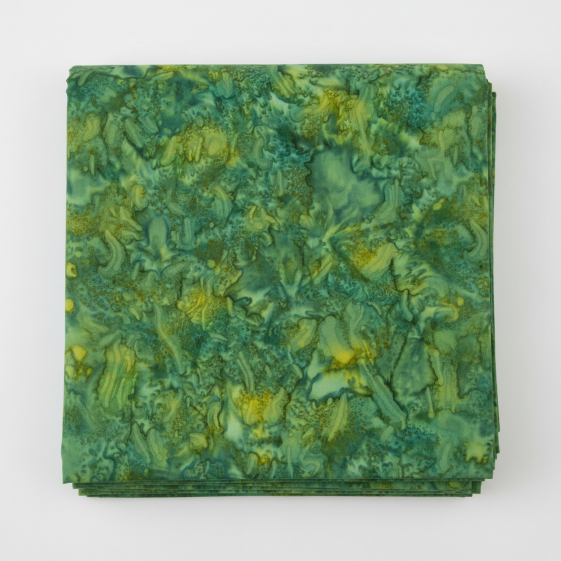 Expressions Batiks Hand-Dyes Amazon quilting cotton fabric by Riley Blake Designs folded into a neat square showing rich jungle green hand-dyed batik with warm golden-yellow undertones and organic swirling mottled texture – a vibrant tonal blender, 100% cotton batik, 43–44" wide