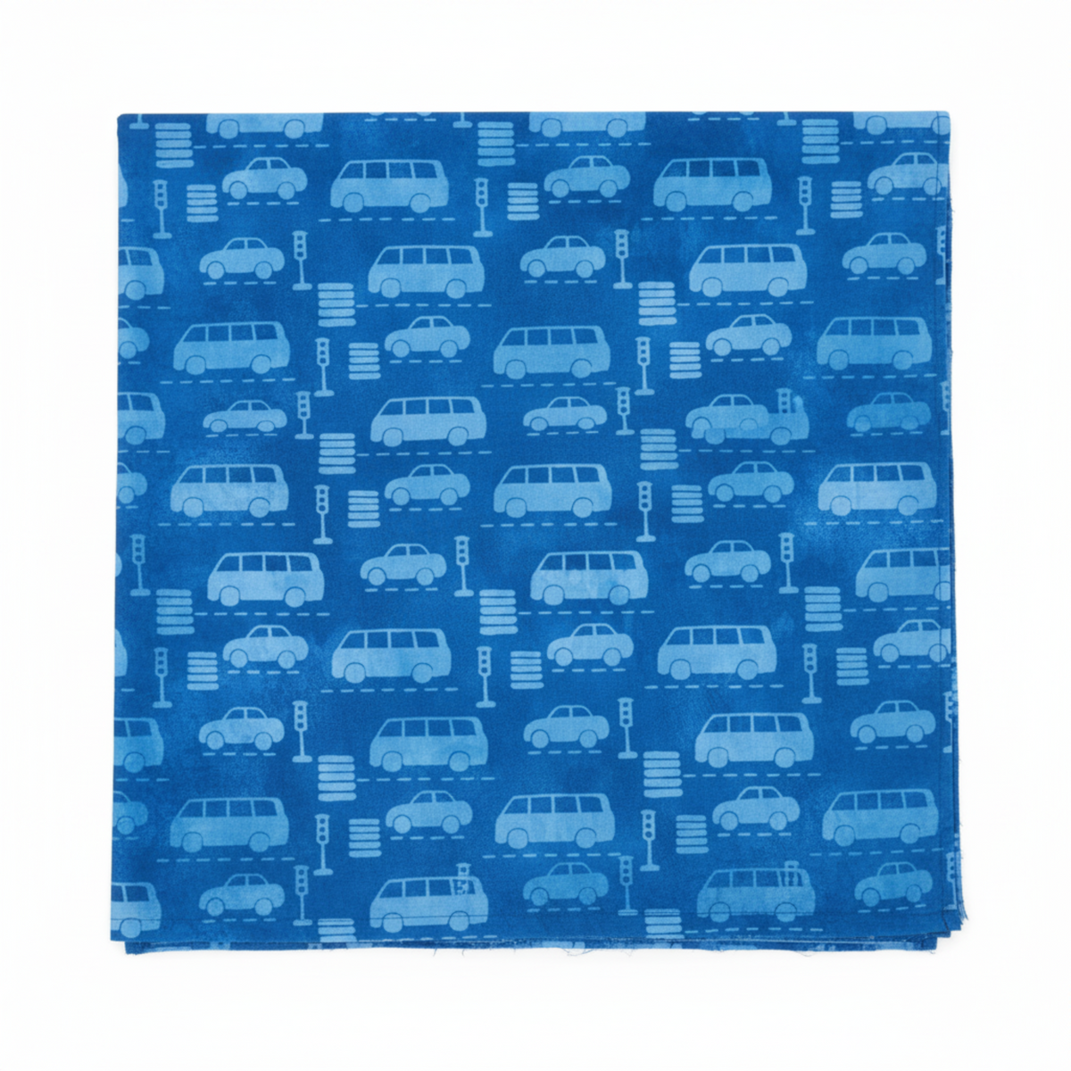On the Go Automobiles Blue quilting cotton by Jason Yenter for In The Beginning Fabrics — close-up flat lay with ruler showing scale of tone-on-tone sedan, van, and SUV silhouettes with traffic lights and crosswalk stripes on a deep cobalt-blue ground, 100% cotton, 43–44" wide.