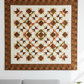 Autumn Vibes quilt with Interwoven Olive by Jason Yenter for In The Beginning Fabrics – radiating pinwheel medallion in warm olive, cream, rust and dusty rose with bold olive border. Autumn Vibes Quilt Pattern by Sew On The Go. Shop Interwoven Olive at IraRobi Quilts | #autumnvibes #quiltingfabric #olivefabric #interwoven #fallquilt #modernquilt