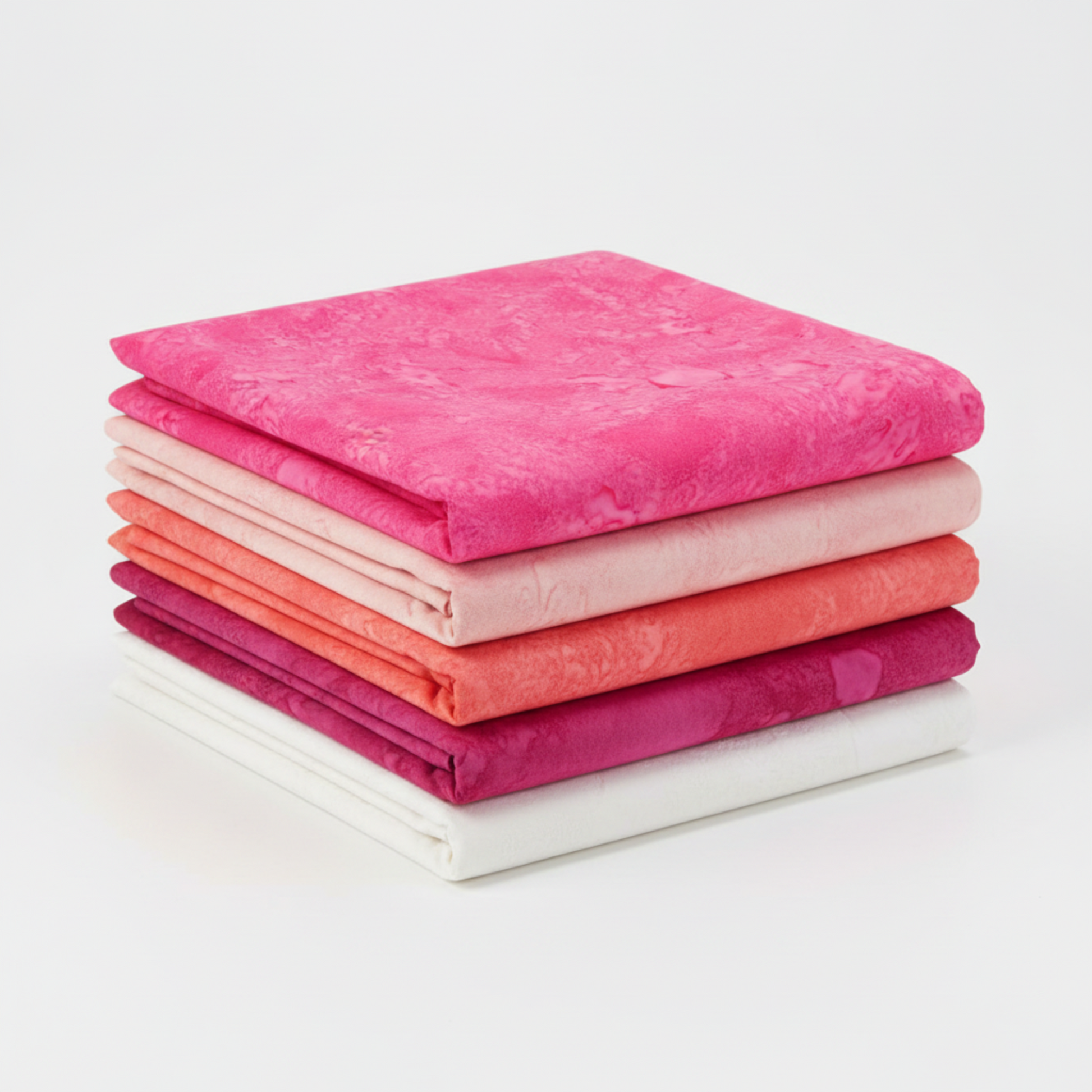 Five coordinating pink tonal batik fabrics in a neat folded stack featuring Expressions Batiks Hand-Dyes Begonia by Riley Blake Designs in pure saturated hot pink on top, with coordinating soft blush, vibrant coral-orange, deep magenta, and crisp white near-solid tonal batiks below – 100% cotton
