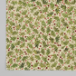 Winter Solstice II Beige Twigs Metallic quilting cotton by Jason Yenter for In The Beginning Fabrics — close-up flat lay showing tossed watercolor green fern sprigs with scattered red berry dots and tiny gold metallic berry clusters on warm beige and cream ground, 100% cotton with metallic accents, 43–44" wide. Coordinating fabrics and quilt patterns are available at IraRobi Quilts.