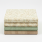 Four coordinating tonal batik and blender fabrics in a neat folded stack featuring Expressions Batik Breathe Laurel by Riley Blake Designs in cream and ivory on top, with coordinating ecru, soft sage green, and warm taupe tonal batiks below – 100% cotton