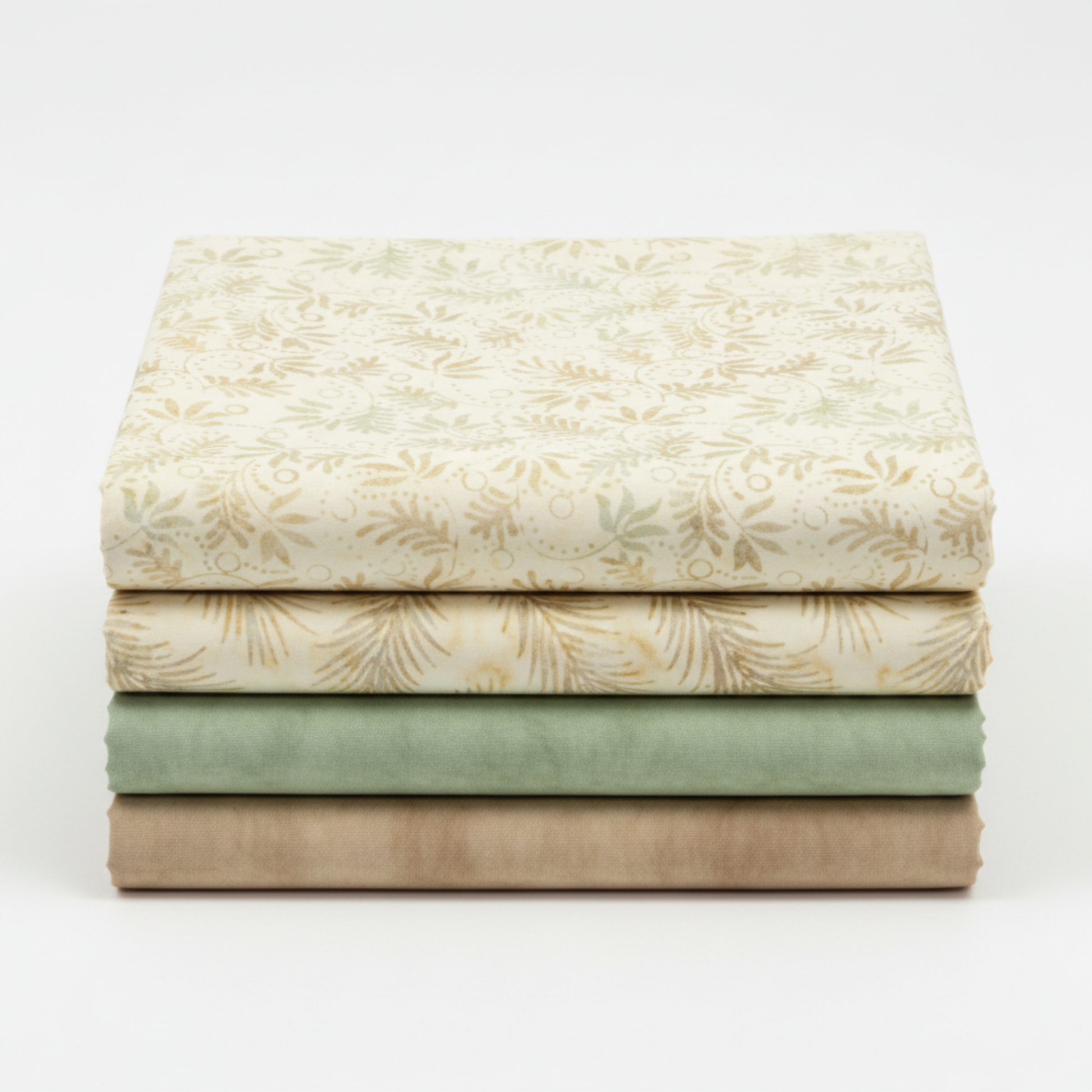Four coordinating tonal batik and blender fabrics in a neat folded stack featuring Expressions Batik Breathe Laurel by Riley Blake Designs in cream and ivory on top, with coordinating ecru, soft sage green, and warm taupe tonal batiks below – 100% cotton