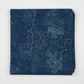 Carpet Bag Romance Blue Brocade quilting cotton fabric folded to show tonal patchwork of damask, brocade, scrollwork, and medallion motifs – deep navy and steel blue faded-carpet collage by Jason Yenter for In The Beginning Fabrics, 100% cotton, 3 yard cut
