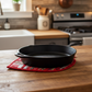 Handmade Christmas Red quilted leaf hot pad under a cast iron skillet – shop at IraRobi Quilts | #handmadekitchen #hotpad #quilted"