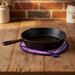 Handmade Lavender Garden quilted leaf hot pad under a cast iron skillet | IraRobi Quilts #handmadekitchen #hotpad #quilted