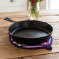 Handmade Indigo Berry quilted leaf hot pad under a cast iron skillet with wildflowers | IraRobi Quilts #handmadekitchen #hotpad #farmhouse