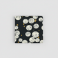 Celestial News Dropping Onyx quilt fabric by Zen Chic for Moda Fabrics, neatly folded on light grey background showing full print repeat