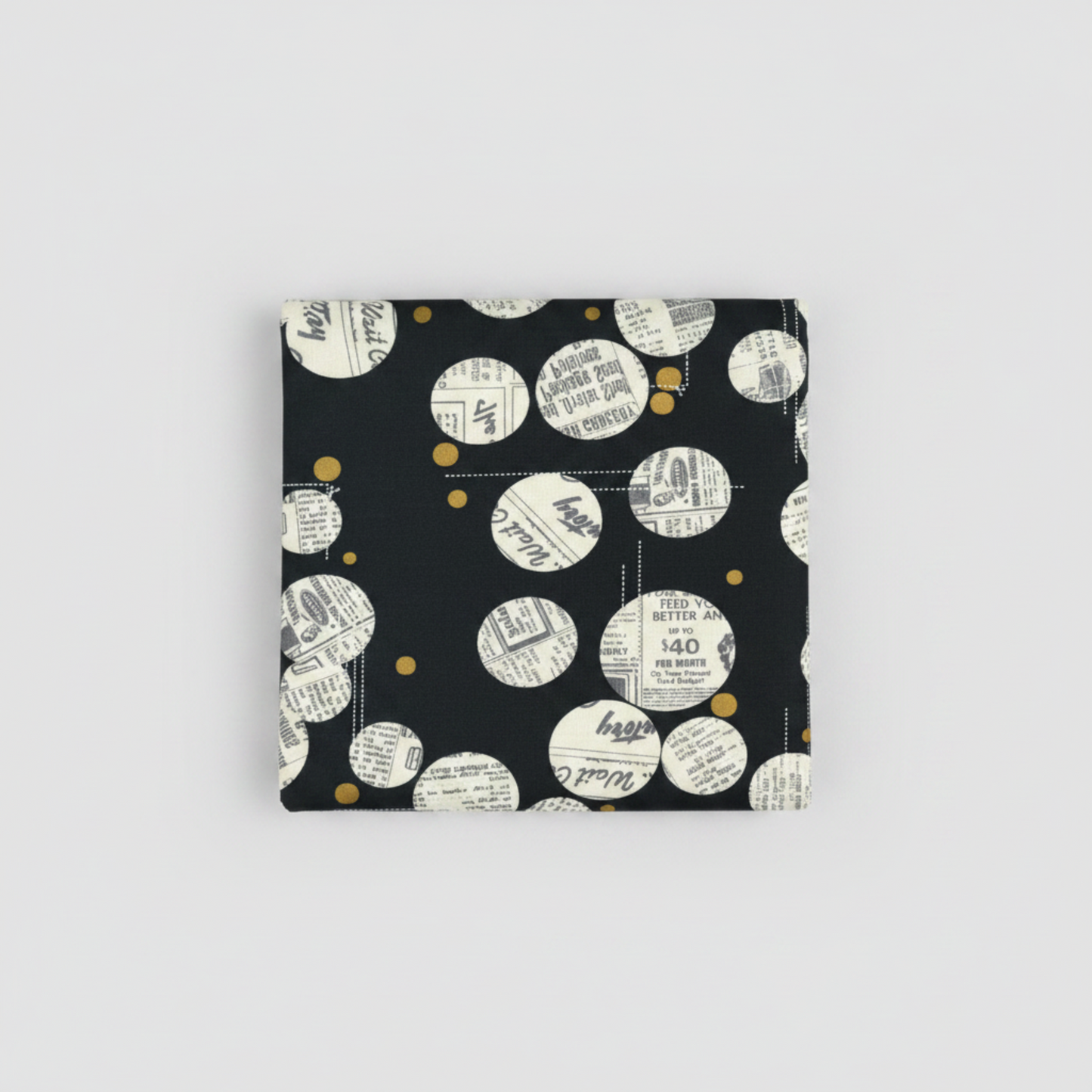 Celestial News Dropping Onyx quilt fabric by Zen Chic for Moda Fabrics, neatly folded on light grey background showing full print repeat
