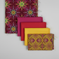 What If Radio Star Red/Multi fabric in cascading staircase with Interwoven Magenta, Red, Yellow and Good Vibes Gold/Multi — quilting color palette by Paula Nadelstern for Benartex