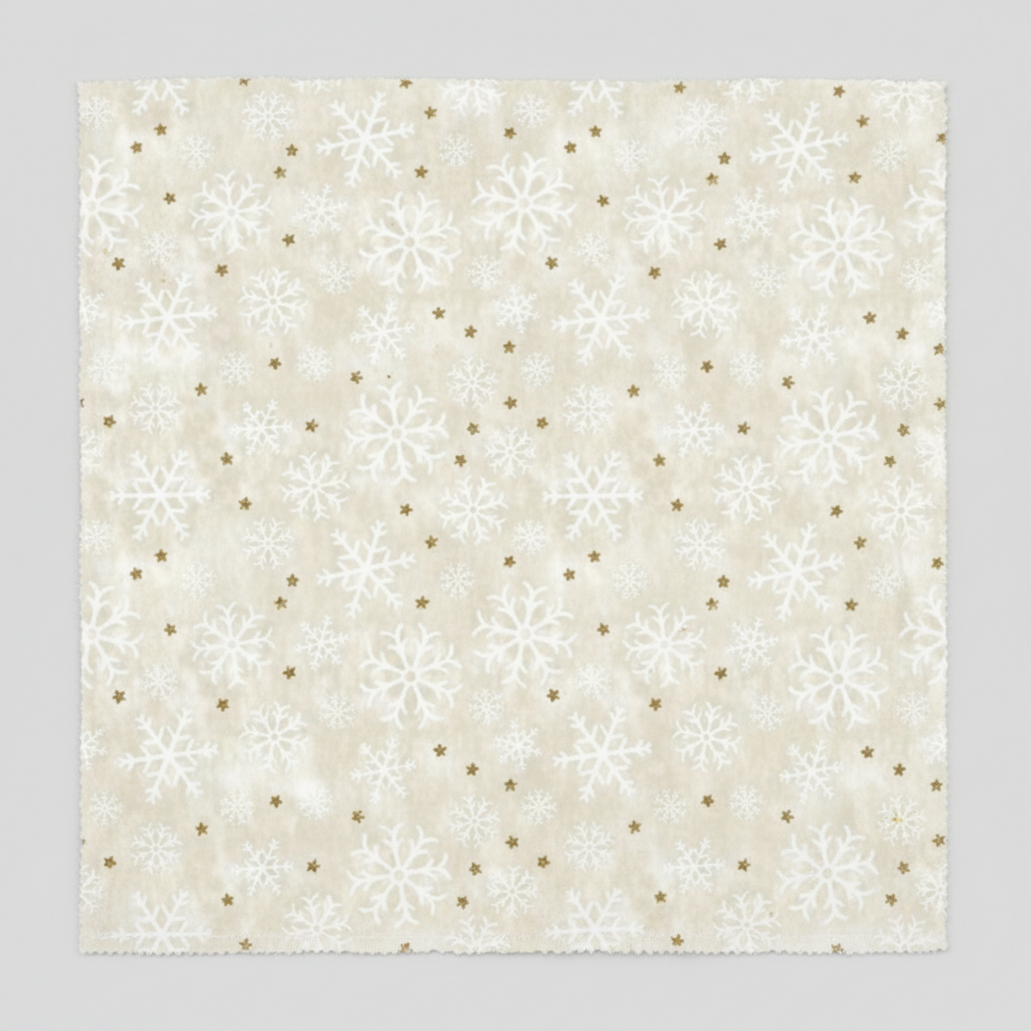 Winter Solstice II Cream Snowflakes Metallic quilting cotton by Jason Yenter for In The Beginning Fabrics — close-up flat lay showing tossed white snowflakes in multiple sizes with tiny scattered gold metallic star dots on warm mottled ecru and cream ground, 100% cotton with metallic accents, 43–44" wide. Coordinating fabrics and quilt patterns are available at IraRobi Quilts.